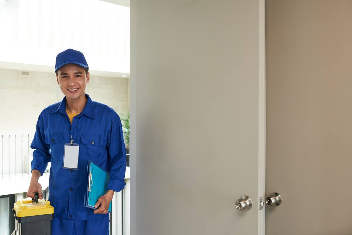 Handyman with a toolbox arriving for a house call