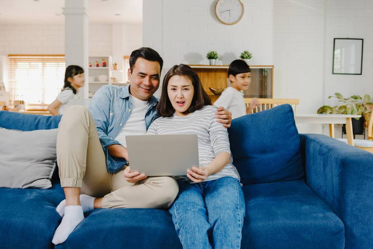A family relaxing in the living room at home