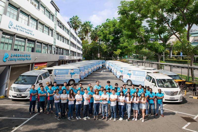 Technicians and service vans outside the office by Jiaxing Aircon
