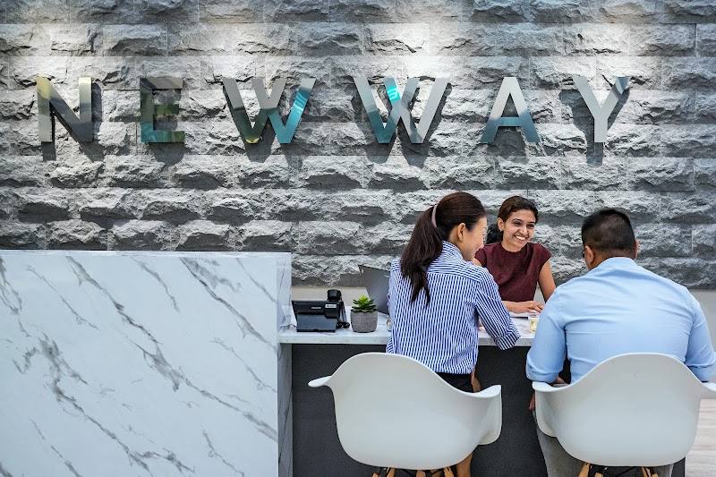 Staff with customers at the front counter of the showroom by Newway Air Conditioning