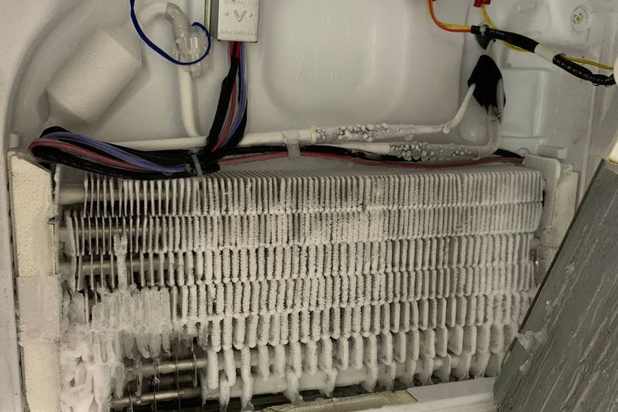 Fridge opened up to reach a frozen evaporator coil by A-MAC Home Repair