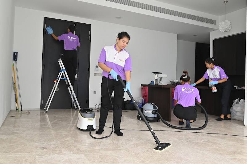 Cleaning team steam-mopping and wiping down an empty condo by GOVICO