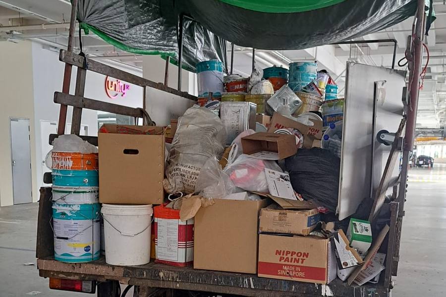 Lorry loaded with paint tins, boxes and junk by dispose.sg