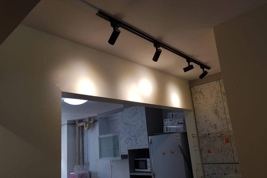 Track lights fitted over a kitchen opening by SK Electrical
