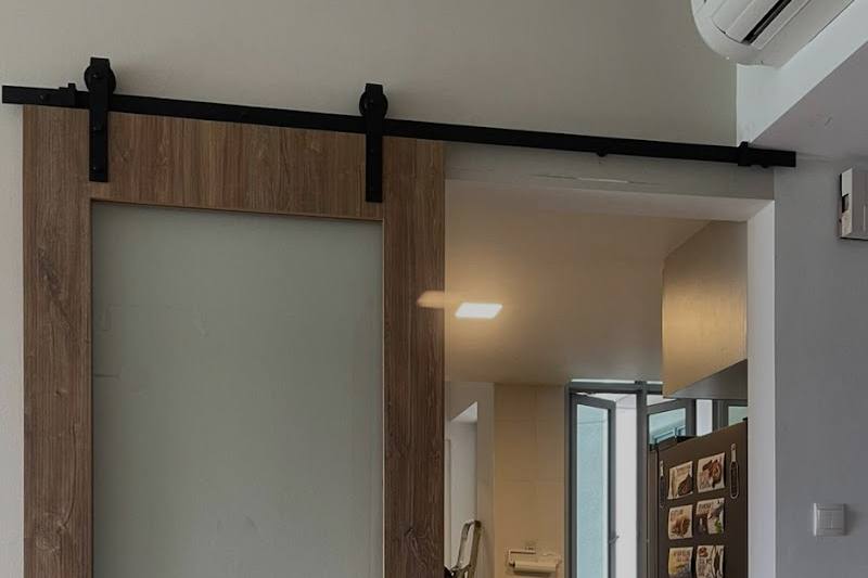 Sliding barn door fitted in a flat by Handyman Top Services