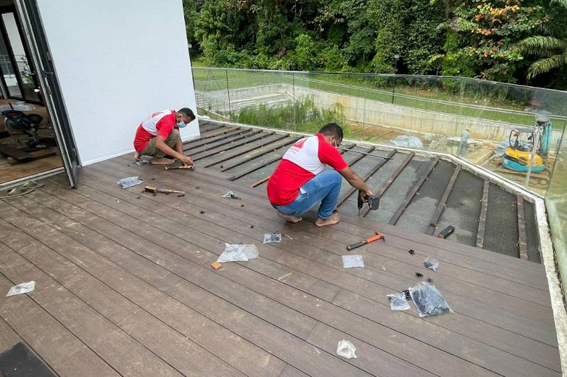 Outdoor timber decking being laid by Joydom Engineering