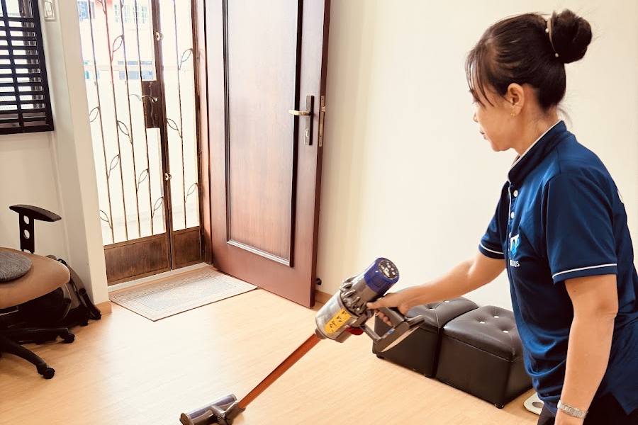 A cleaner vacuuming a floor by Nimbus Homes