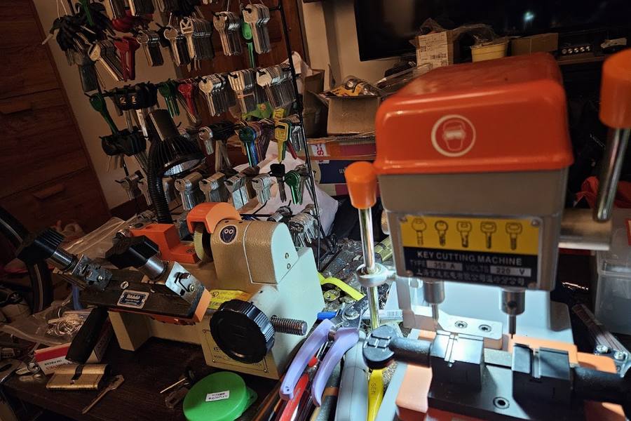 Key-cutting machines and key blanks in the workshop by Alex Locksmith