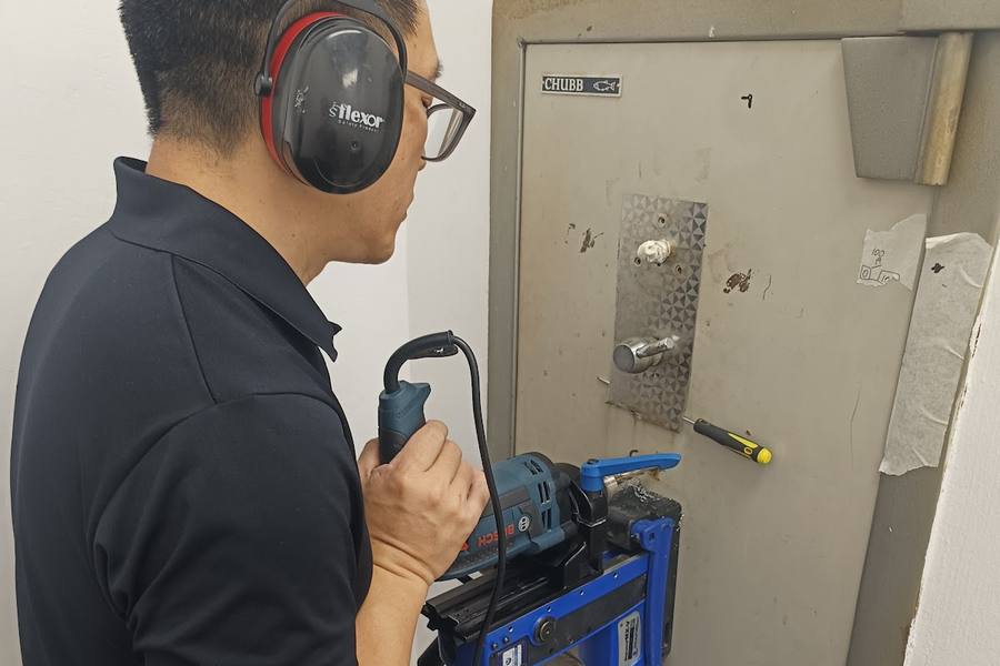 A technician drilling open an old safe by Keyeo Locks & Security