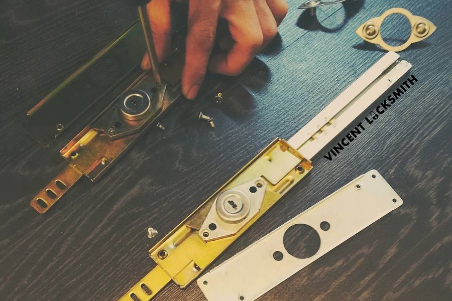 A door lock being taken apart for repair by Vincent Locksmith