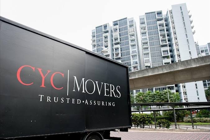 A branded moving truck outside a condo by CYC Movers