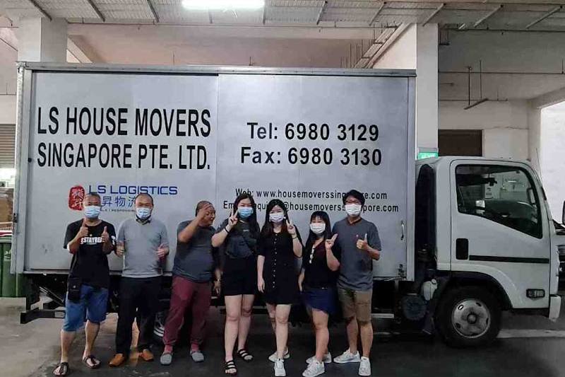 The team in front of a branded moving truck by LS House Movers