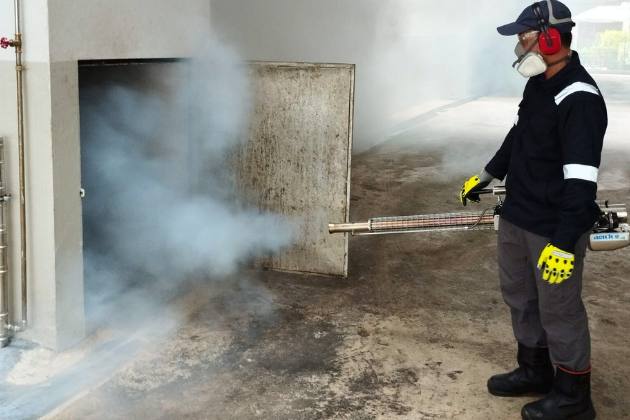 Technician thermal fogging a bin area by Bingo Pest