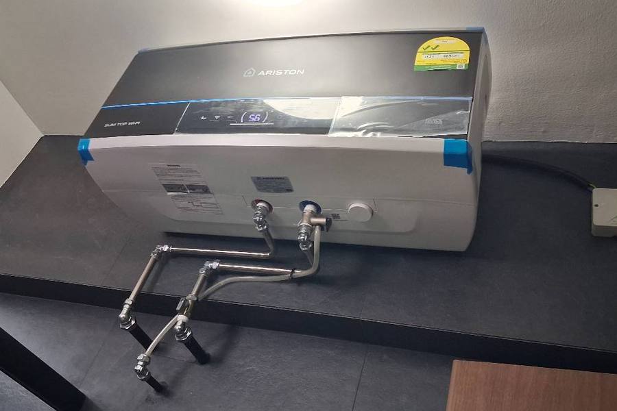 Newly installed storage water heater with new pipes by Direct Plumber SG