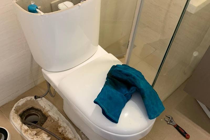 Toilet bowl lifted off its outlet to clear a choke by Reliable Plumbing Services (Licensed Plumber)